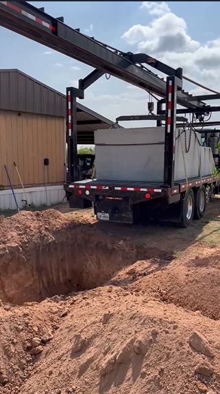 Crane at storm shelter installation in Roaring Springs TX
