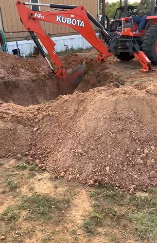 Kubota digging in rocky soil in Roaring Springs TX