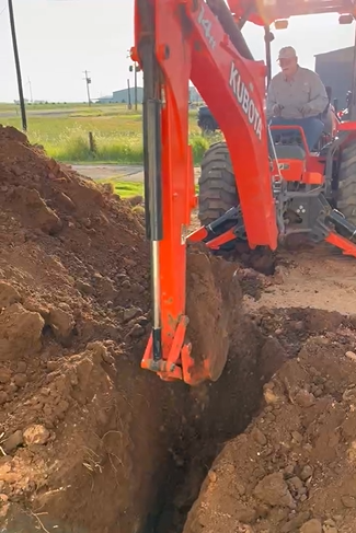 Kubota excavating for storm shelter in Roaring Springs TX