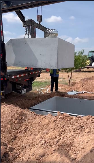 Lid placement on storm shelter in Spur TX